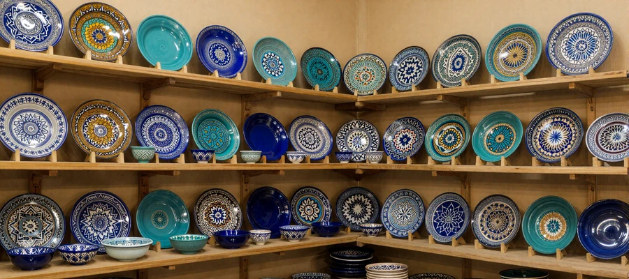 Traditional Uzbek ceramic workshop in Bukhara showcasing turquoise and cobalt craftsmanship